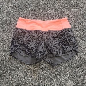 Lululemon speed up shorts, black/gray/hot salmon, size 4. 4" inseam.